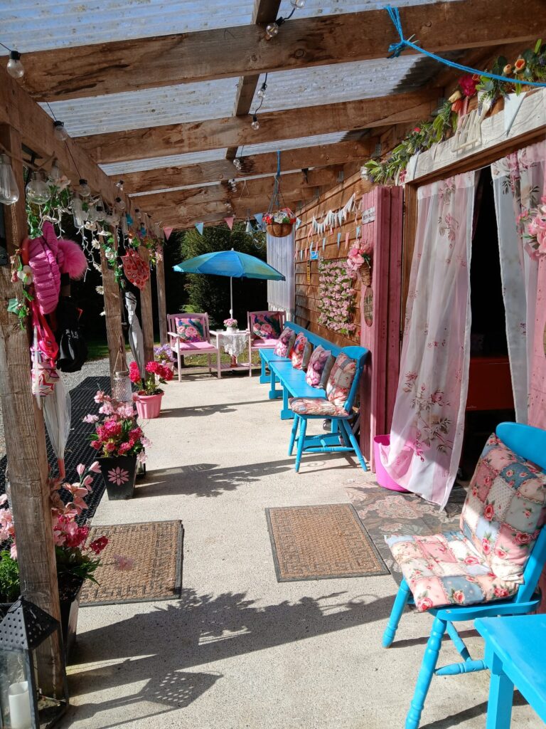Decorated covered walkway with bunting and seating